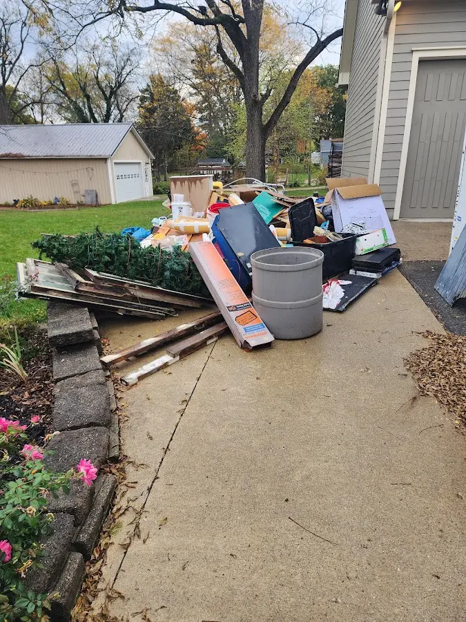 Dumpster being loaded with debris for Demolition Dumpster Rental in East Liverpool